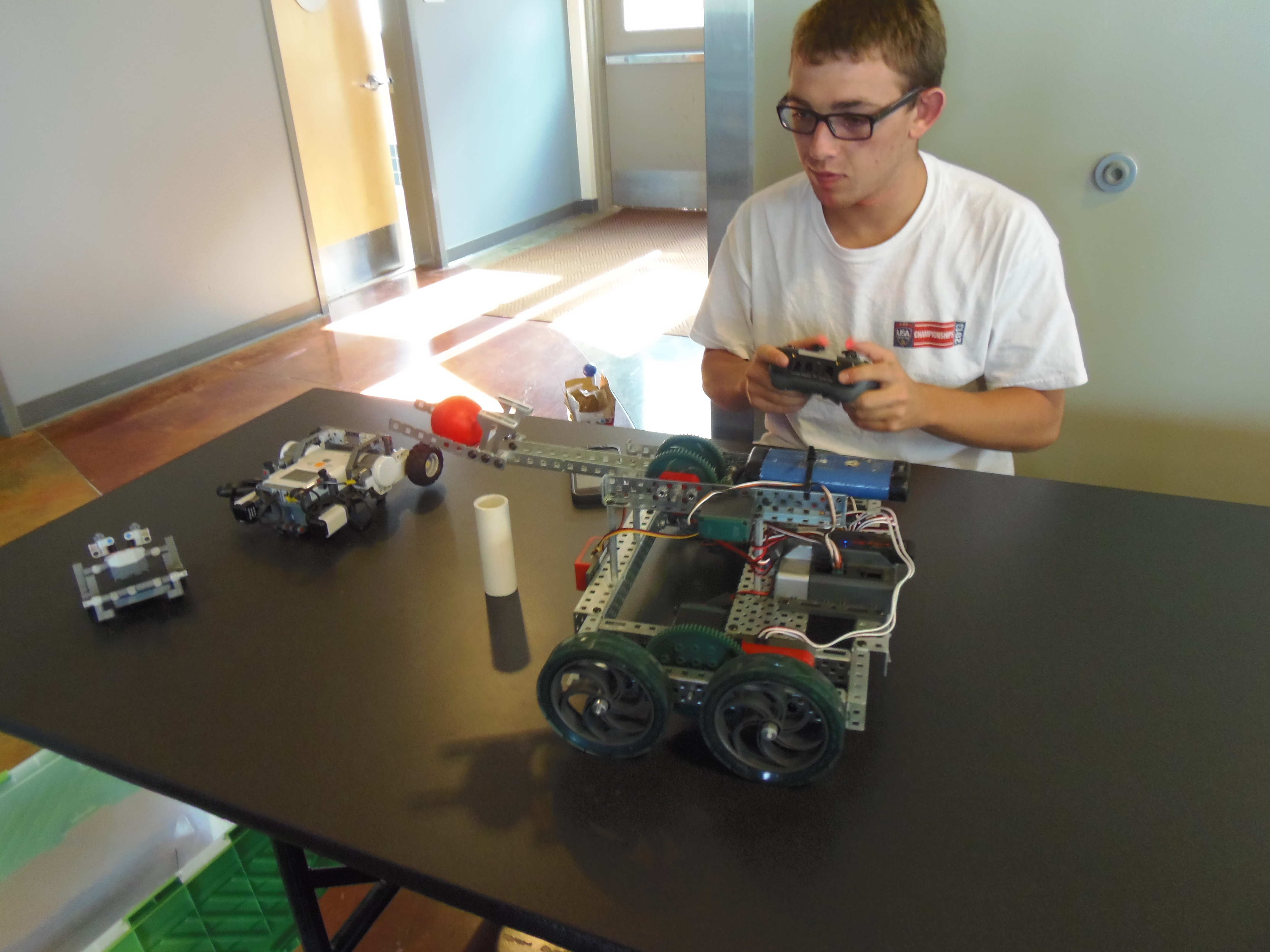 student playing with remote control car